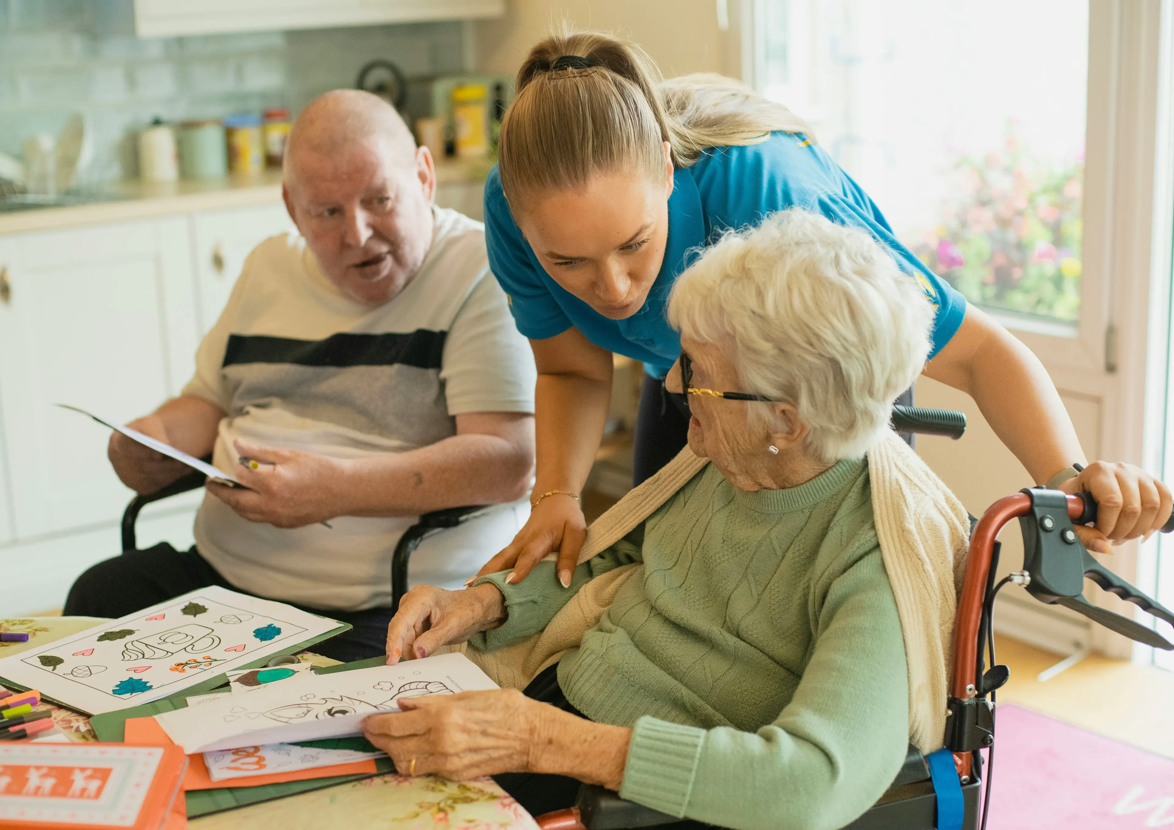 Carer and client in a warm, personal moment of support at home